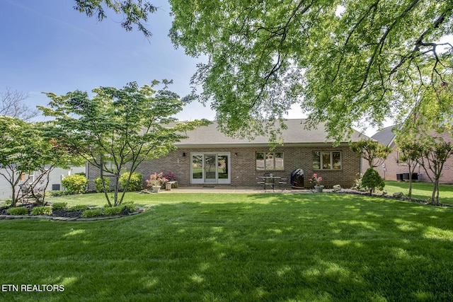 212 Tooweka Ln, Loudon, TN 37774 - back of property with a yard and brick siding
