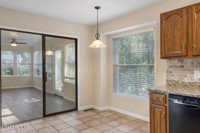 unfurnished dining area featuring light tile patterned floors and a wealth of natural light
