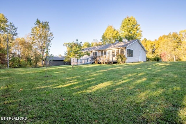 back of property featuring a yard