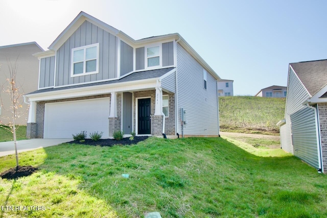 2141 Glen Crk, Knoxville, TN 37924 - view of front of home with a front yard, an attached garage, board and batten siding, brick siding, and driveway