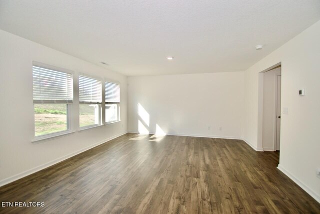 2141 Glen Crk, Knoxville, TN 37924 - spare room with dark wood-type flooring and baseboards
