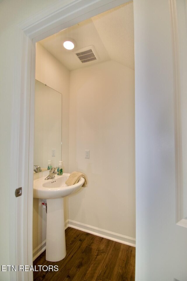 2141 Glen Crk, Knoxville, TN 37924 - bathroom with lofted ceiling, visible vents, baseboards, and wood finished floors