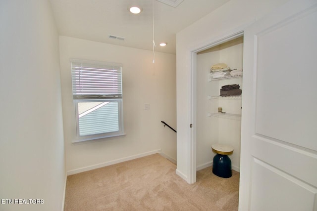 2141 Glen Crk, Knoxville, TN 37924 - hallway with light carpet, attic access, baseboards, and an upstairs landing