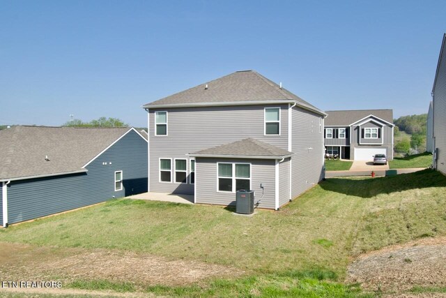 2141 Glen Crk, Knoxville, TN 37924 - back of property with a yard, cooling unit, and a shingled roof