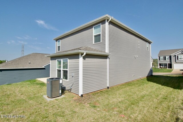 2141 Glen Crk, Knoxville, TN 37924 - view of side of home featuring a yard and central air condition unit