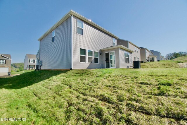 2141 Glen Crk, Knoxville, TN 37924 - rear view of house with a yard and central AC