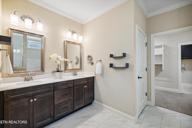bathroom featuring baseboards, a sink, and marble finish floor
