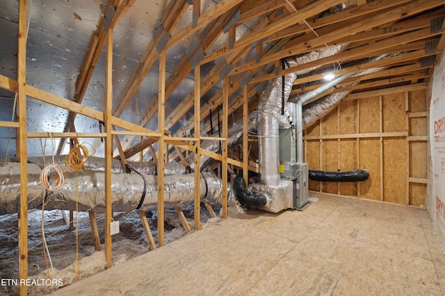 attic featuring heating unit