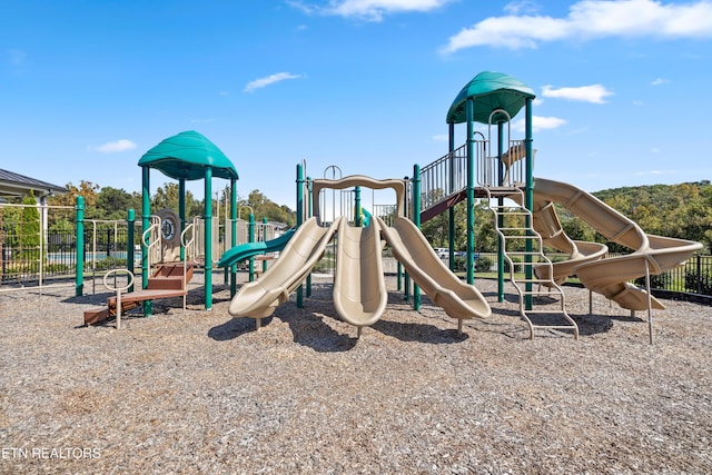 communal playground featuring fence