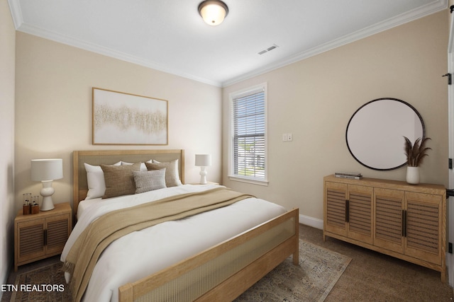 bedroom featuring baseboards, visible vents, ornamental molding, and dark colored carpet