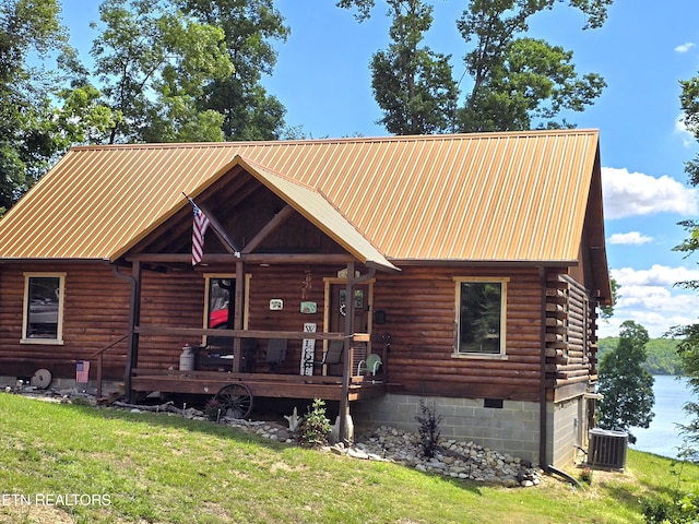 2116 Riverview Dr, Dandridge, TN 37725 - cabin with a porch, a front yard, central air condition unit, metal roof, and log exterior