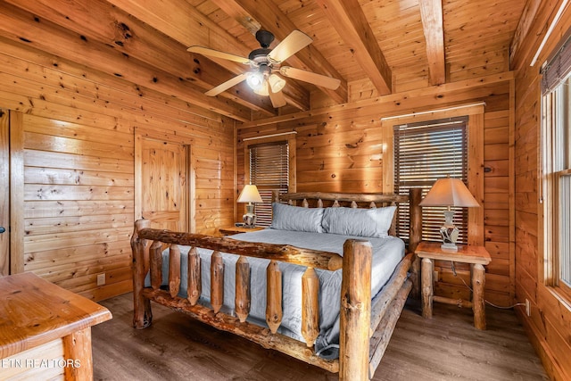 bedroom with a ceiling fan, wooden ceiling, wood walls, wood finished floors, and beam ceiling
