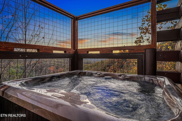exterior space with a hot tub