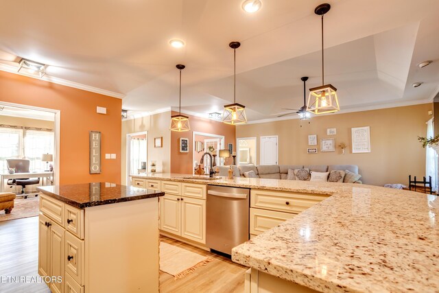 kitchen with open floor plan, light wood-style flooring, a center island, stainless steel dishwasher, and a sink
