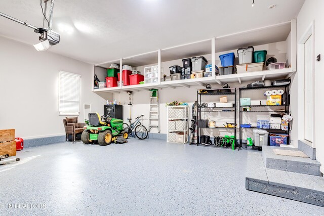 garage featuring a garage door opener