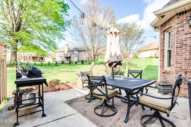 view of patio / terrace with grilling area, a residential view, and outdoor dining area