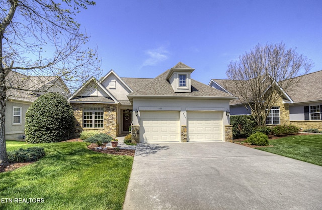 989 Rarity Bay Pkwy, Vonore, TN 37885 - view of front of property with stucco siding, an attached garage, stone siding, and a front lawn