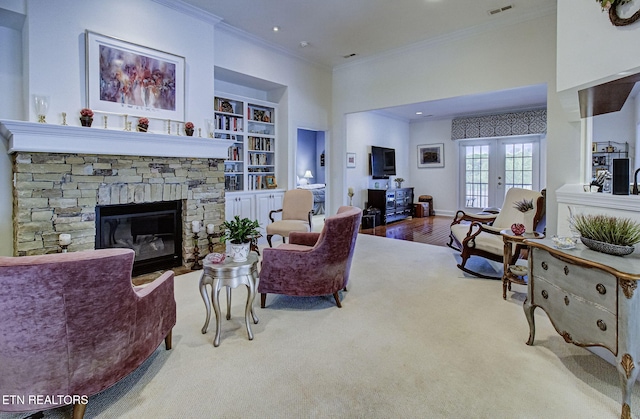 989 Rarity Bay Pkwy, Vonore, TN 37885 - carpeted living room with crown molding, built in shelves, a fireplace, visible vents, and recessed lighting