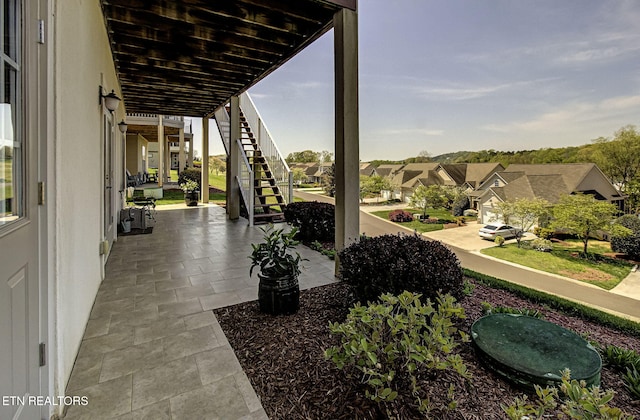 989 Rarity Bay Pkwy, Vonore, TN 37885 - view of patio / terrace featuring a residential view and stairway