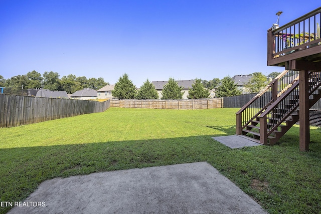 view of yard featuring a patio, stairway, a fenced backyard, and a deck