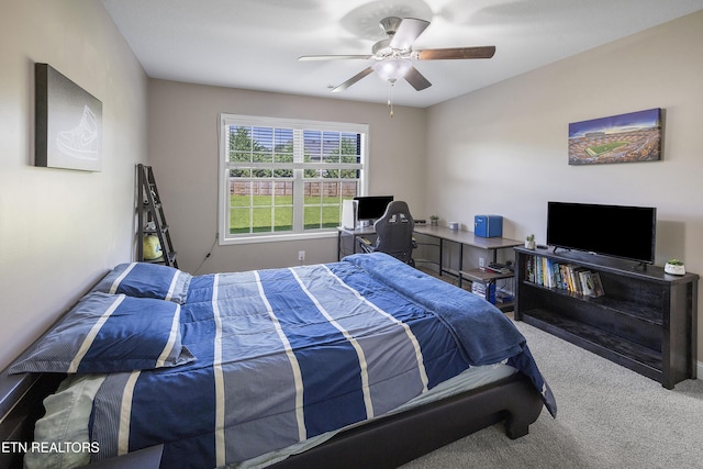 carpeted bedroom with a ceiling fan