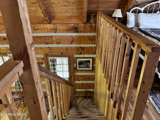 2580 Black Bear Ln, Sevierville, TN 37876 - staircase with beam ceiling, wood walls, and wooden ceiling