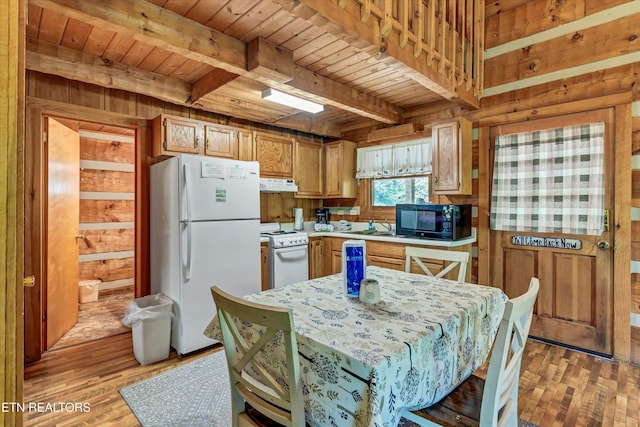 2580 Black Bear Ln, Sevierville, TN 37876 - kitchen featuring wooden ceiling, under cabinet range hood, beamed ceiling, and white appliances