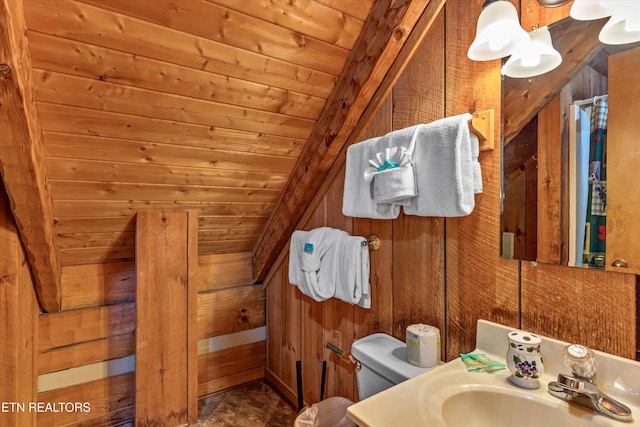 2580 Black Bear Ln, Sevierville, TN 37876 - bathroom with lofted ceiling, wooden walls, wooden ceiling, and a sink