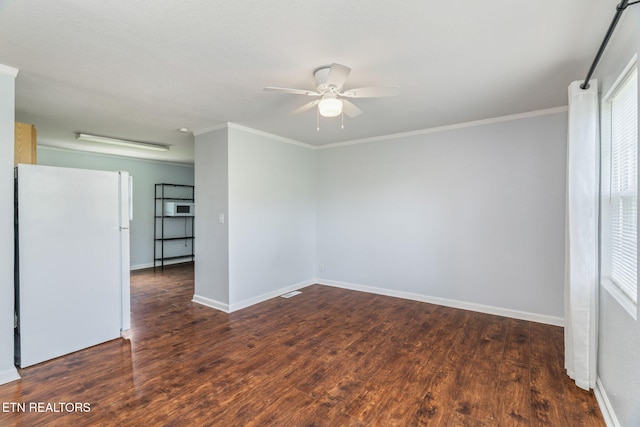 369 Robertsville Rd, Oak Ridge, TN 37830 - spare room featuring ceiling fan, wood finished floors, baseboards, and crown molding