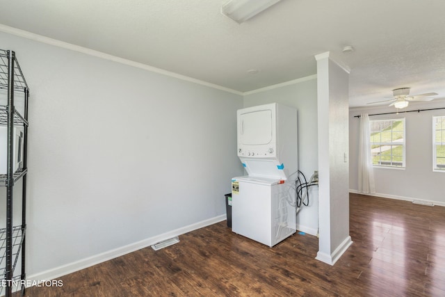 369 Robertsville Rd, Oak Ridge, TN 37830 - washroom featuring stacked washing machine and dryer, crown molding, a ceiling fan, wood finished floors, and baseboards