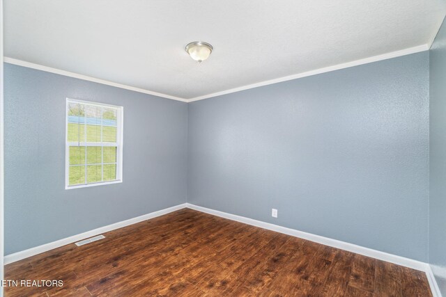 369 Robertsville Rd, Oak Ridge, TN 37830 - unfurnished room with ornamental molding, dark wood finished floors, and baseboards
