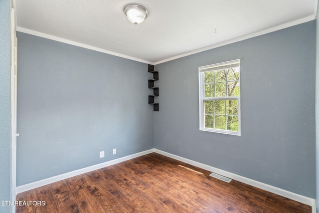 369 Robertsville Rd, Oak Ridge, TN 37830 - spare room with baseboards, crown molding, and dark wood-style floors