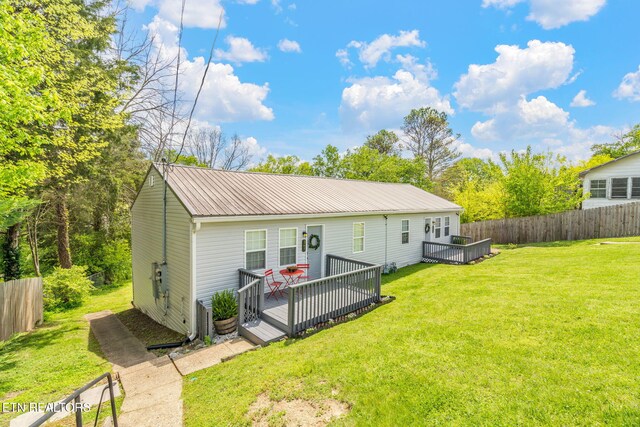 369 Robertsville Rd, Oak Ridge, TN 37830 - rear view of property with a wooden deck and metal roof