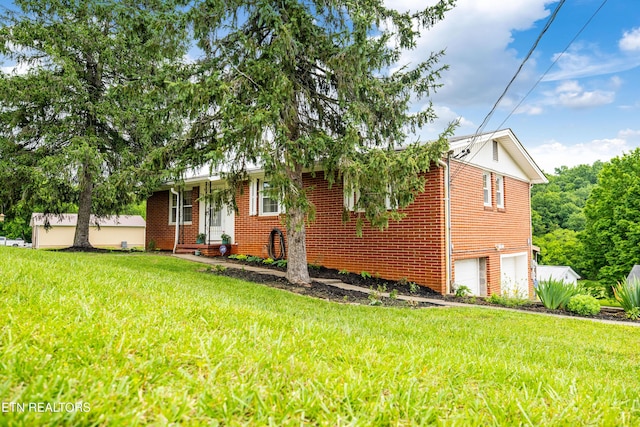 7324 Thorn Grove Pike, Knoxville, TN 37914 - view of front of property with a garage, a front yard, and brick siding