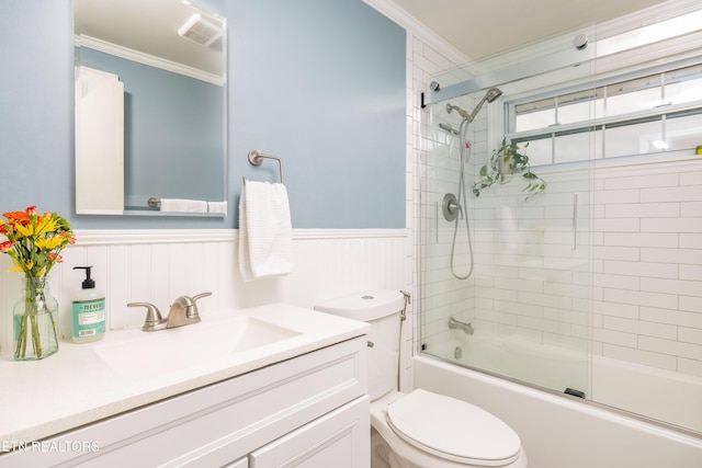 7324 Thorn Grove Pike, Knoxville, TN 37914 - bathroom featuring ornamental molding, toilet, vanity, wainscoting, and enclosed tub / shower combo