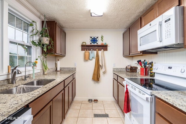7324 Thorn Grove Pike, Knoxville, TN 37914 - kitchen with white appliances, baseboards, a sink, light tile patterned floors, and a textured ceiling