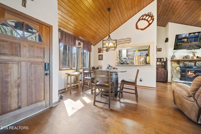 1348 N Baden Cir, Gatlinburg, TN 37738 - dining area with wood ceiling, an inviting chandelier, and baseboards