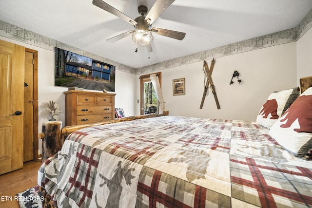 1348 N Baden Cir, Gatlinburg, TN 37738 - bedroom featuring wood finished floors, ceiling fan, and access to exterior