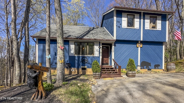 1348 N Baden Cir, Gatlinburg, TN 37738 - view of front of house featuring crawl space, roof with shingles, and entry steps