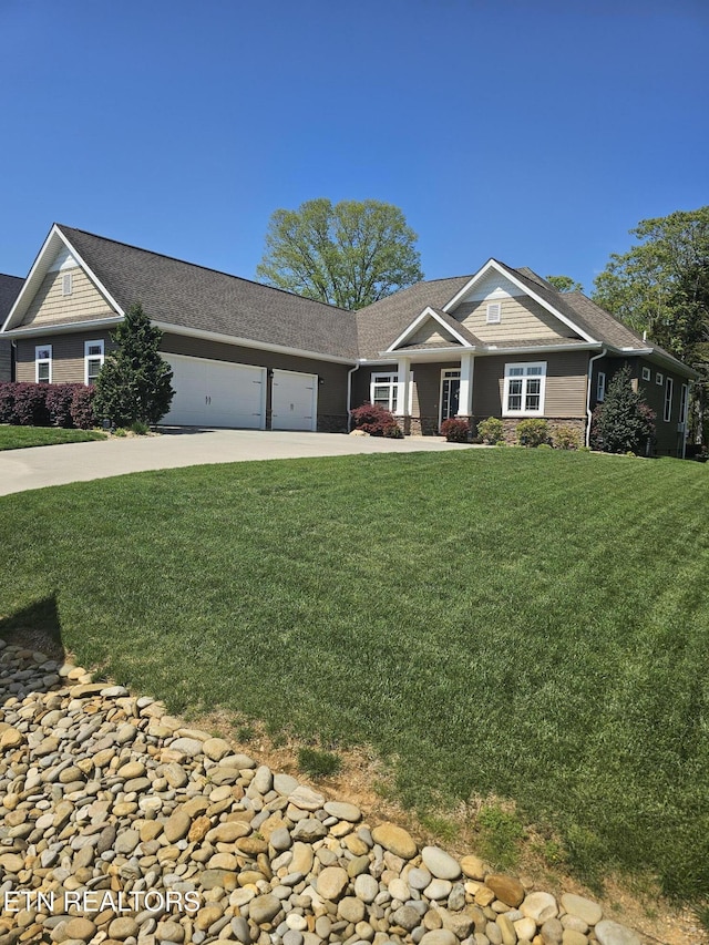 169 Dudi Trl, Vonore, TN 37885 - craftsman inspired home with stone siding, concrete driveway, a front yard, and a garage