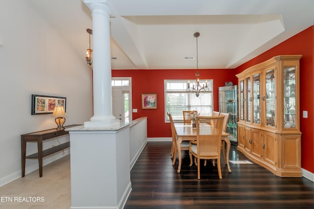 169 Dudi Trl, Vonore, TN 37885 - dining room with baseboards, visible vents, an inviting chandelier, ornate columns, and wood finished floors