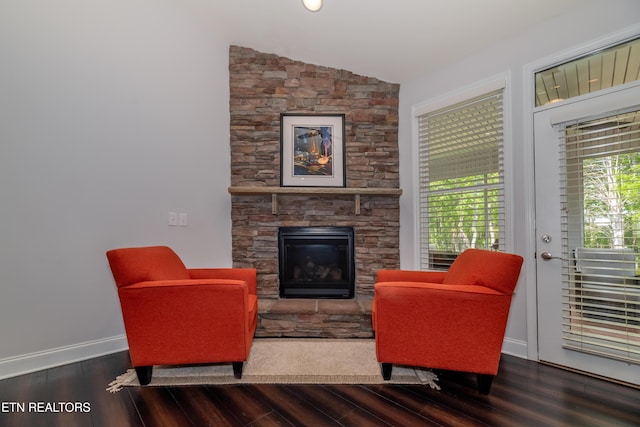 169 Dudi Trl, Vonore, TN 37885 - living area with vaulted ceiling, a stone fireplace, baseboards, and wood finished floors