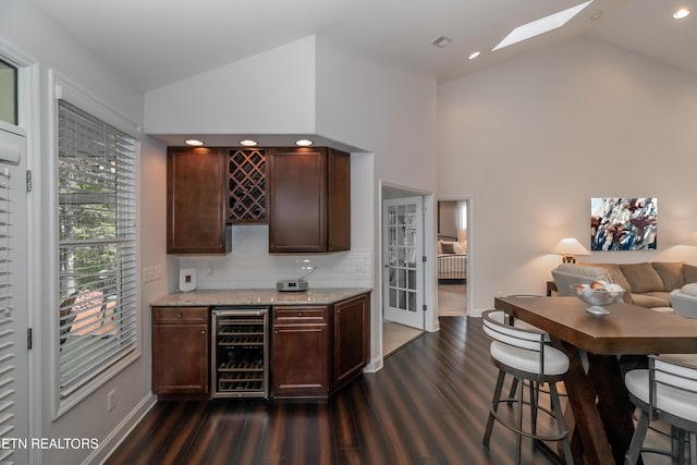 169 Dudi Trl, Vonore, TN 37885 - bar featuring dark wood-style floors, wine cooler, backsplash, a dry bar, and baseboards