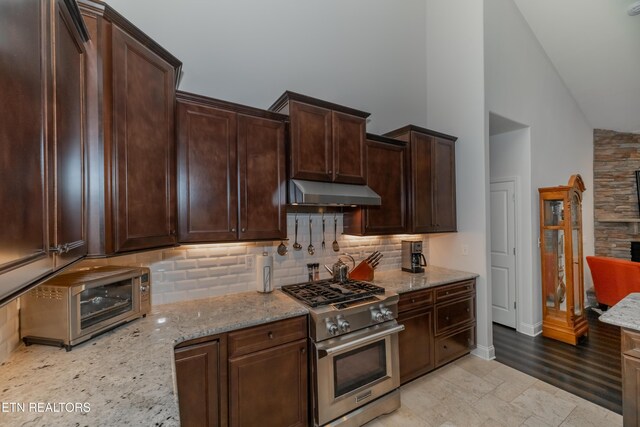 169 Dudi Trl, Vonore, TN 37885 - kitchen with high end range, under cabinet range hood, tasteful backsplash, and a toaster