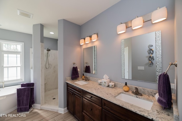169 Dudi Trl, Vonore, TN 37885 - bathroom with walk in shower, visible vents, baseboards, and a sink