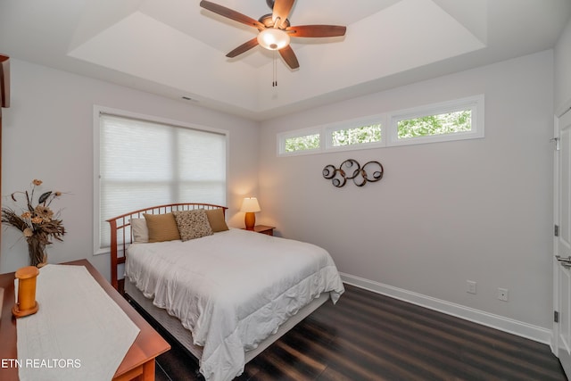 169 Dudi Trl, Vonore, TN 37885 - bedroom with dark wood finished floors, baseboards, visible vents, and a raised ceiling