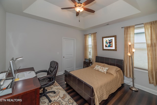 169 Dudi Trl, Vonore, TN 37885 - bedroom with a raised ceiling, baseboards, dark wood-style floors, and multiple windows