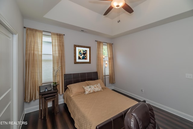 169 Dudi Trl, Vonore, TN 37885 - bedroom with dark wood-style floors, visible vents, baseboards, ceiling fan, and a raised ceiling
