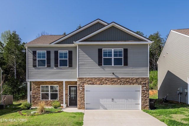 2740 Red Barn Rd, Knoxville, TN 37931 - craftsman house with driveway, stone siding, an attached garage, and a front lawn