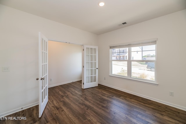 2740 Red Barn Rd, Knoxville, TN 37931 - spare room featuring dark wood-type flooring, french doors, and baseboards
